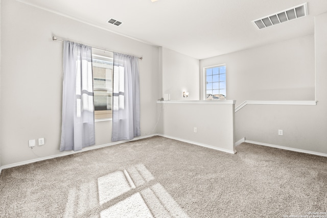 unfurnished room with carpet floors