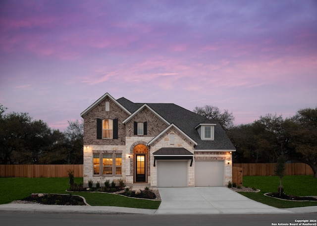 view of front of house with a yard