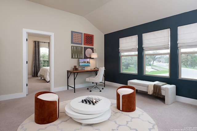 carpeted home office with lofted ceiling