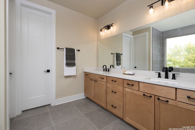 bathroom featuring tile patterned flooring and vanity