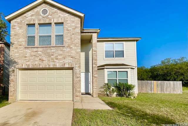 front of property with a front yard and a garage