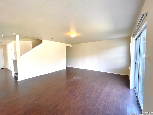 empty room with dark wood-type flooring