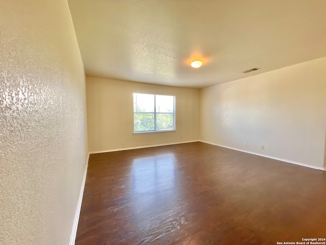 empty room with a textured ceiling