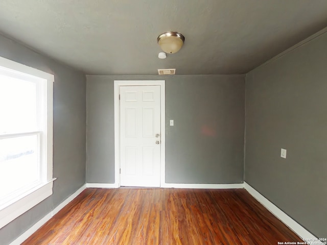 empty room featuring dark wood-type flooring