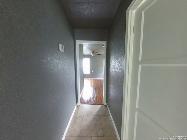 hallway featuring light tile patterned flooring