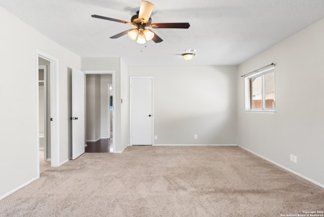 unfurnished room with light carpet and ceiling fan