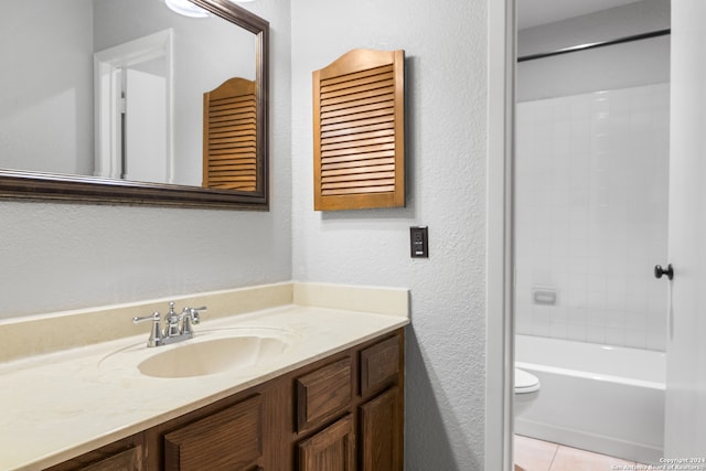 full bathroom with tile patterned floors, vanity, toilet, and washtub / shower combination