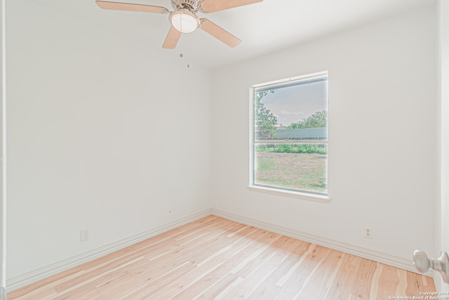 unfurnished room with ceiling fan and light wood-type flooring