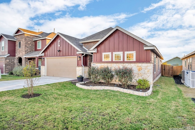 view of front of property with a front yard and a garage