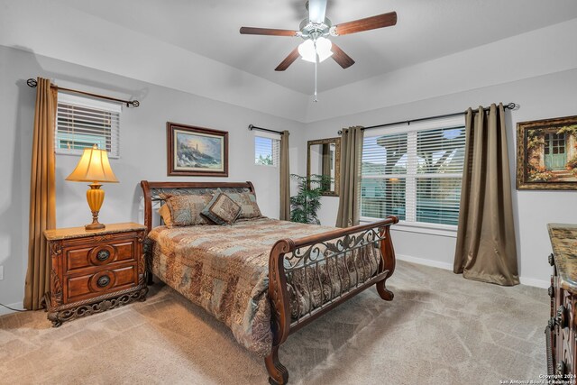 carpeted bedroom featuring ceiling fan