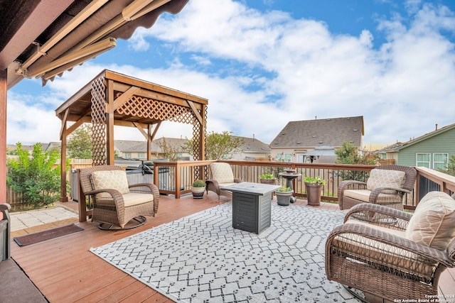 wooden terrace with an outdoor living space