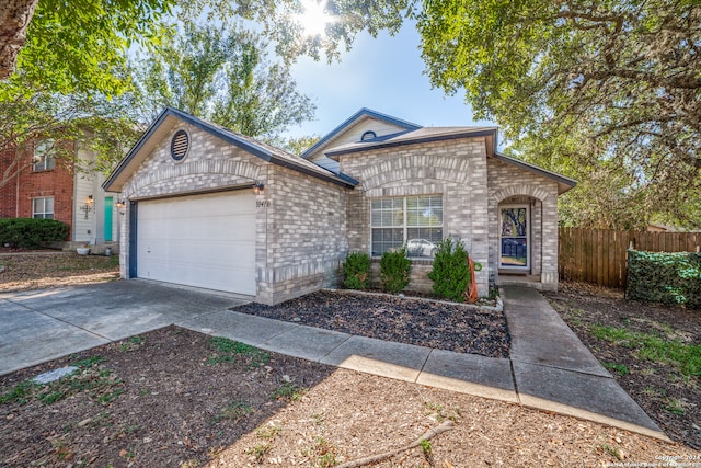 single story home with a garage