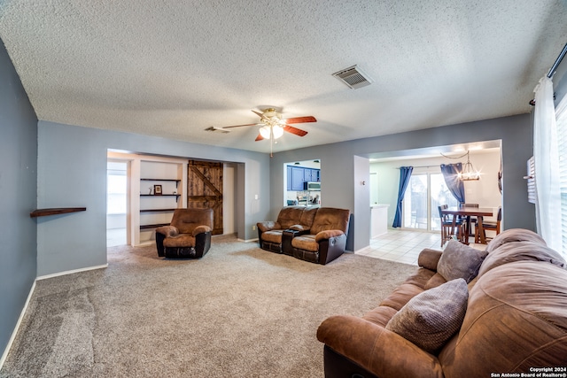 living room with light colored carpet and a textured ceiling