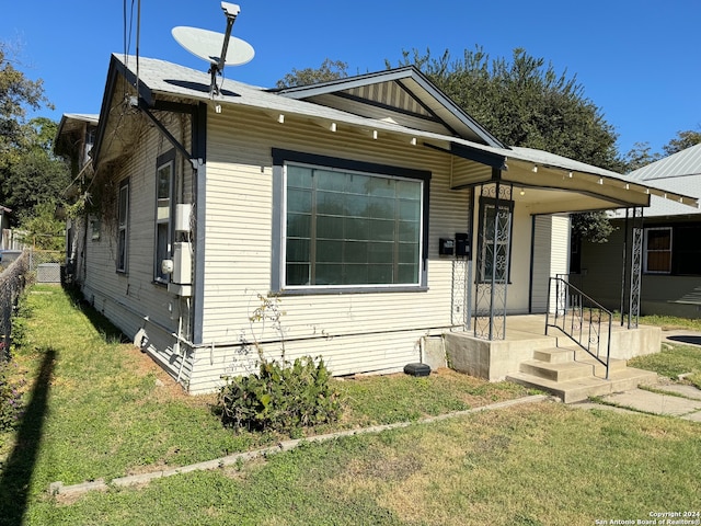 bungalow with a front yard