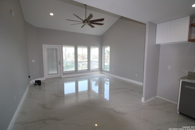 unfurnished living room featuring ceiling fan and high vaulted ceiling