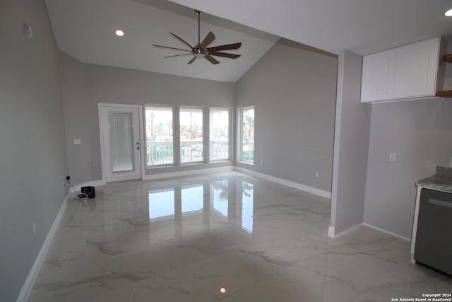 900 Padre Blvd Unit 307, South Padre Island, TX 78597 - unfurnished living room featuring light marble finish floors, baseboards, ceiling fan, high vaulted ceiling, and recessed lighting