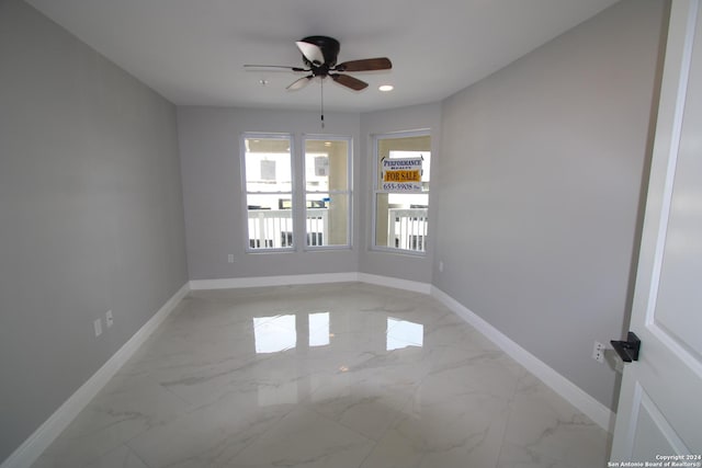900 Padre Blvd Unit 307, South Padre Island, TX 78597 - empty room featuring baseboards, ceiling fan, light marble finish floors, and recessed lighting