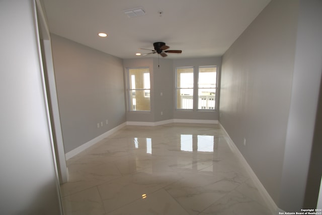 spare room featuring ceiling fan