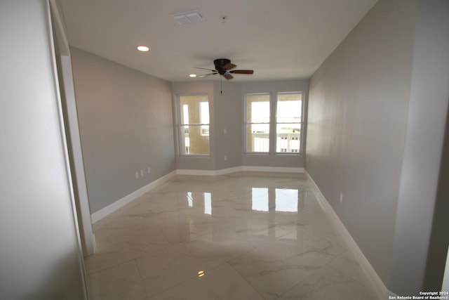 900 Padre Blvd Unit 307, South Padre Island, TX 78597 - spare room with baseboards, light marble finish flooring, a ceiling fan, and recessed lighting