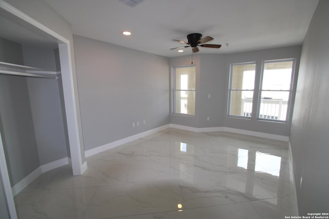 900 Padre Blvd Unit 307, South Padre Island, TX 78597 - unfurnished bedroom featuring baseboards, marble finish floors, and recessed lighting