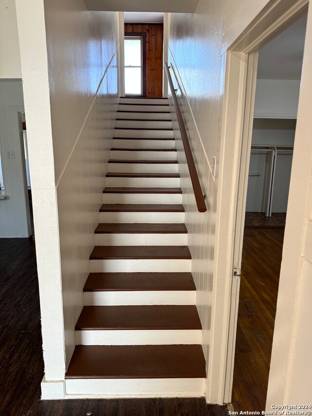 stairs with wood-type flooring