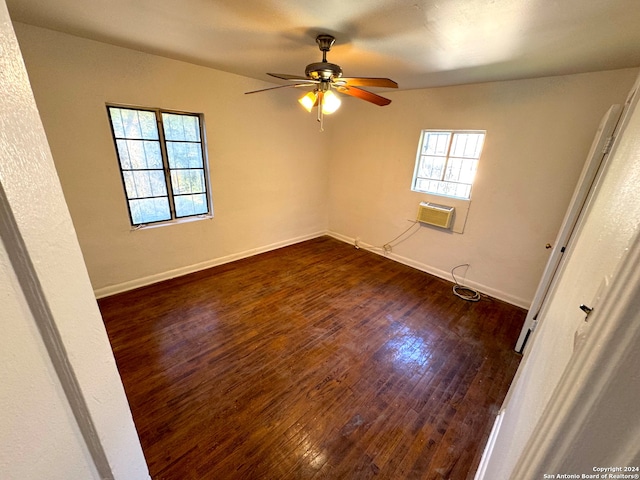 spare room featuring dark hardwood / wood-style floors and ceiling fan