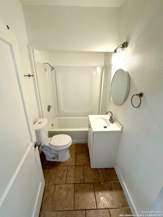 full bathroom featuring washtub / shower combination, vanity, and toilet