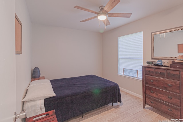 bedroom with ceiling fan and light wood-type flooring