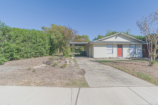 view of front of home with a carport