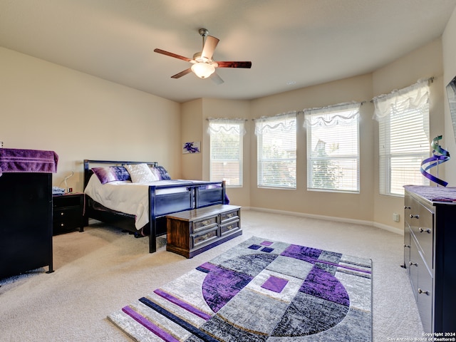 bedroom featuring ceiling fan and light colored carpet