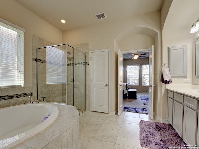 bathroom with tile patterned floors, ceiling fan, independent shower and bath, and vanity