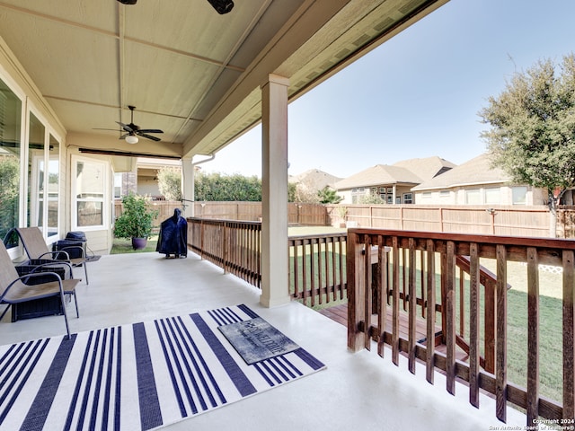 wooden deck with ceiling fan