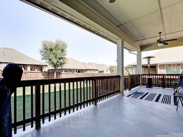 exterior space featuring ceiling fan