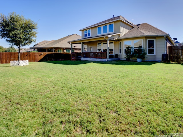 back of house with a yard