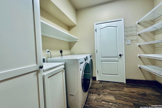 laundry area featuring washer and clothes dryer and dark hardwood / wood-style floors