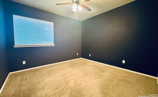 carpeted empty room with ceiling fan