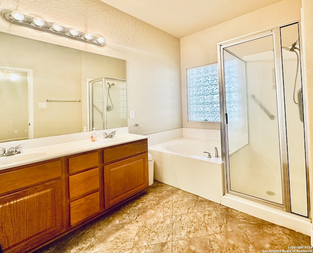 bathroom with plus walk in shower and vanity