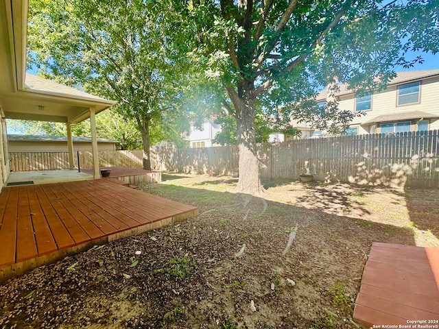 view of yard with a wooden deck