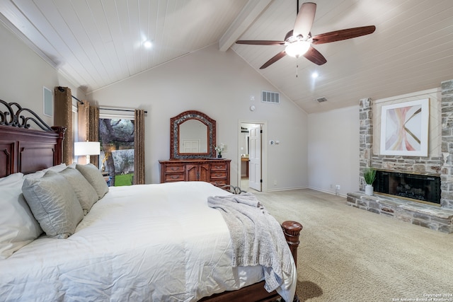 carpeted bedroom featuring wooden ceiling, high vaulted ceiling, a stone fireplace, ceiling fan, and beamed ceiling