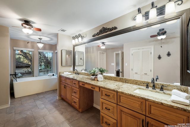 bathroom with a bathing tub and vanity