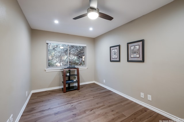 unfurnished room featuring hardwood / wood-style flooring and ceiling fan