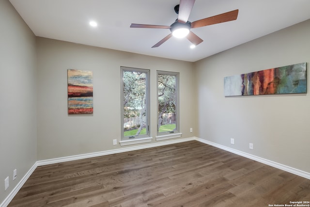 unfurnished room featuring hardwood / wood-style floors and ceiling fan