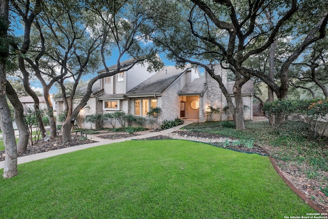 view of front of home with a front lawn