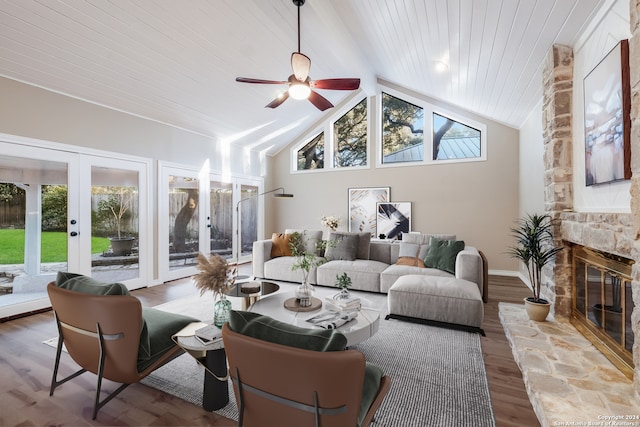 living room with a fireplace, french doors, a healthy amount of sunlight, and wood-type flooring