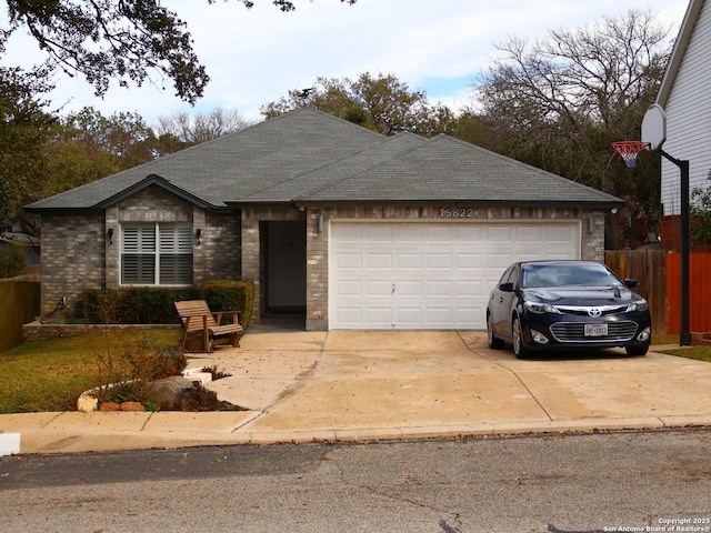 15822 Lomita Springs Dr, San Antonio, TX 78247 - single story home featuring a garage, concrete driveway, brick siding, and a shingled roof