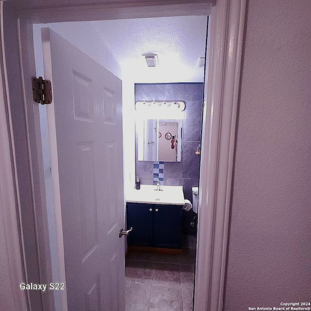 bathroom featuring vanity and a textured ceiling