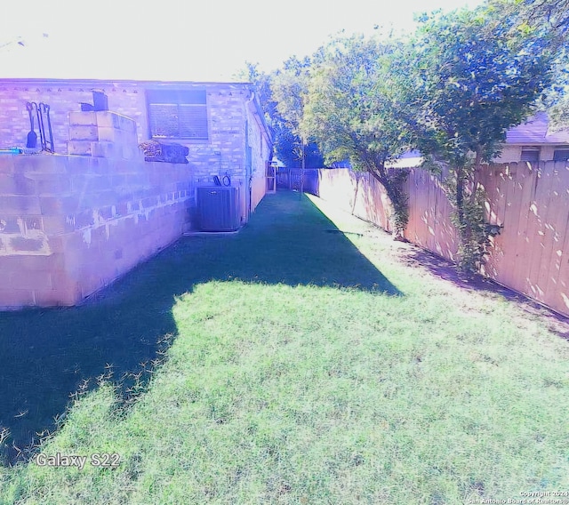 view of yard featuring central AC unit