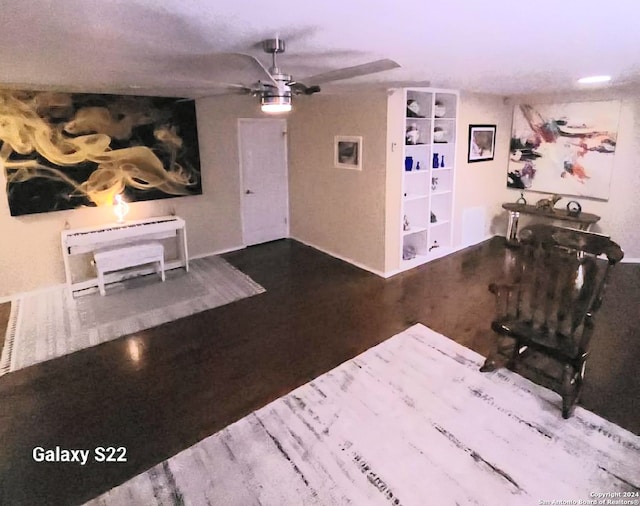 unfurnished living room featuring ceiling fan