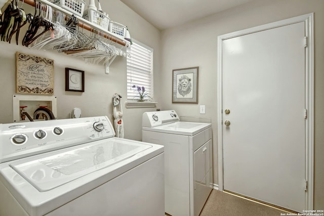 laundry area with carpet and washer and dryer