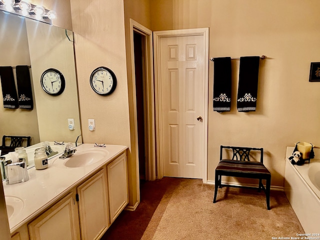 bathroom featuring vanity and a bath